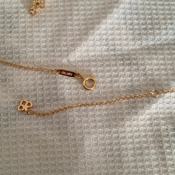 Tiffany & Co. Tiffany T Smile 18k Yellow Gold Mini Pendant Necklace - Picture 10 of 12